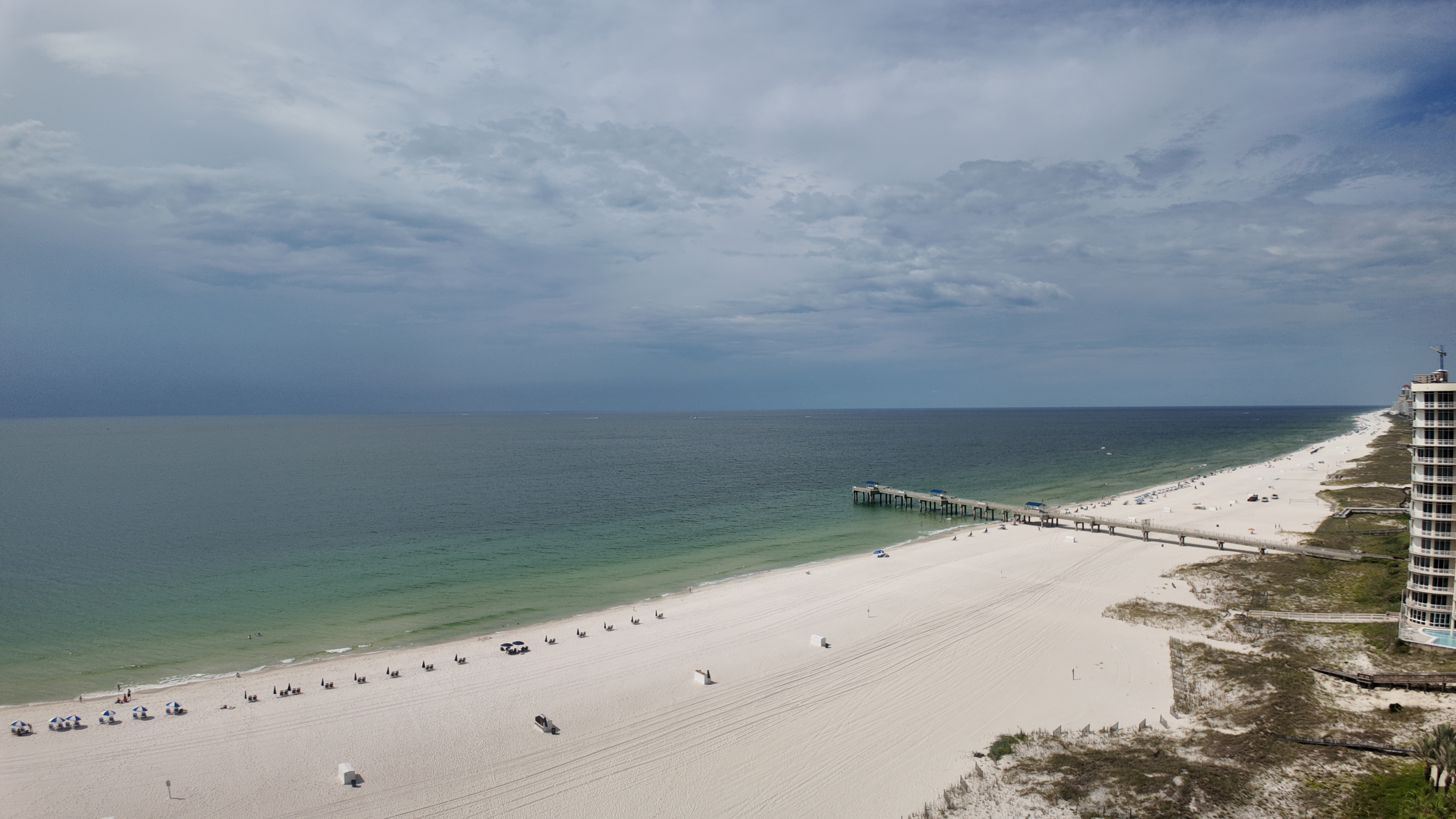Condo deck lifestyle on the Gulf Coast with panoramic beach and water views